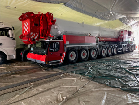 a huge red truck is getting prepared for fumigation